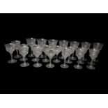 A LATE EDWARDIAN FINE COLLECTION OF TWENTY-THREE WINE AND SHERRY GLASSES All with facet cut bowls,
