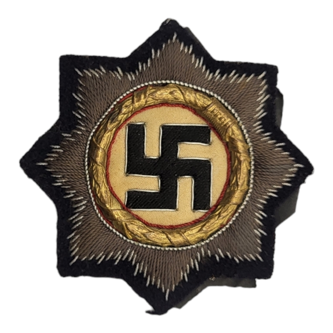 A WWII GERMAN LUFTWAFFE CLOTH CROSS AWARD BADGE Gilt wreath, dated 1941 on black fabric. (approx 7.