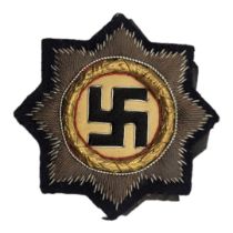 A WWII GERMAN LUFTWAFFE CLOTH CROSS AWARD BADGE Gilt wreath, dated 1941 on black fabric. (approx 7.