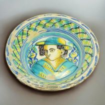 A LARGE 19TH CENTURY SPANISH CERAMIC 'LEBRILLO' BOWL Featuring a vibrant hand-painted decoration