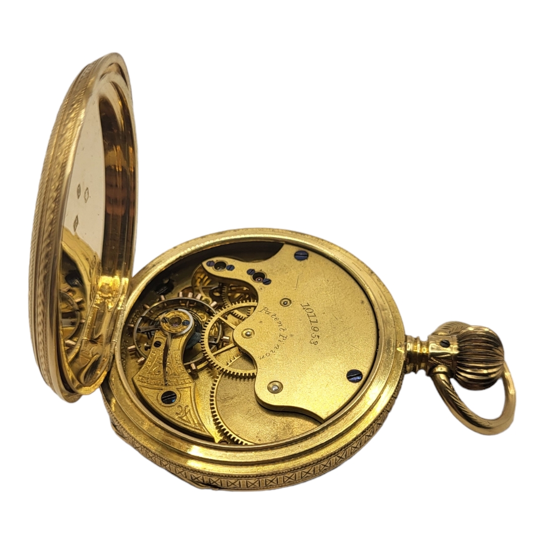 AN EARLY 20TH CENTURY 18CT GOLD POCKET WATCH Open face gold tone dial with engraved decoration to - Image 3 of 3