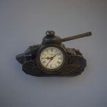 A BRONZE EFFECT METAL CLOCK Taking the form of an early 20th Century tank with turret. (15cm x 5cm x