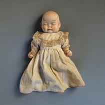 AN UNUSUAL GERMAN DOUBLE FACED BISQUE HEADED CHARACTER BEBE BYE-LO DOLL (possibly Gebruder Heubach),