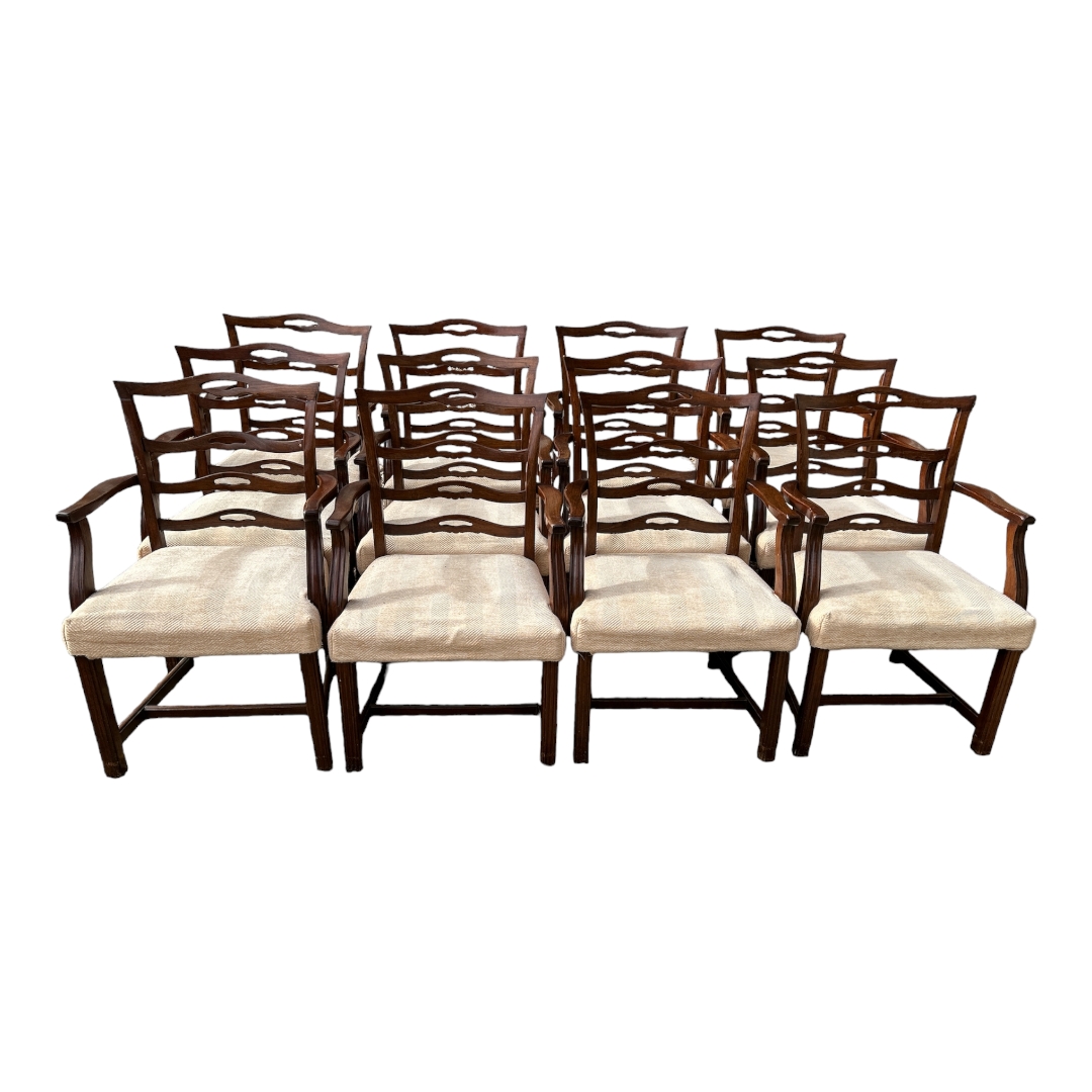 A LONG SET OF TWELVE EARLY 20TH CENTURY GEORGIAN STYLE MAHOGANY OPEN ARM DINING CHAIRS With