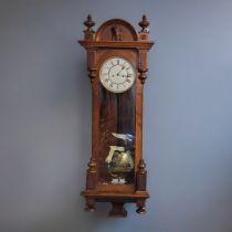 LENZKIRCH, A 19TH CENTURY WALNUT CASED VIENNA CHIMING REGULATOR CLOCK The white enamelled dial