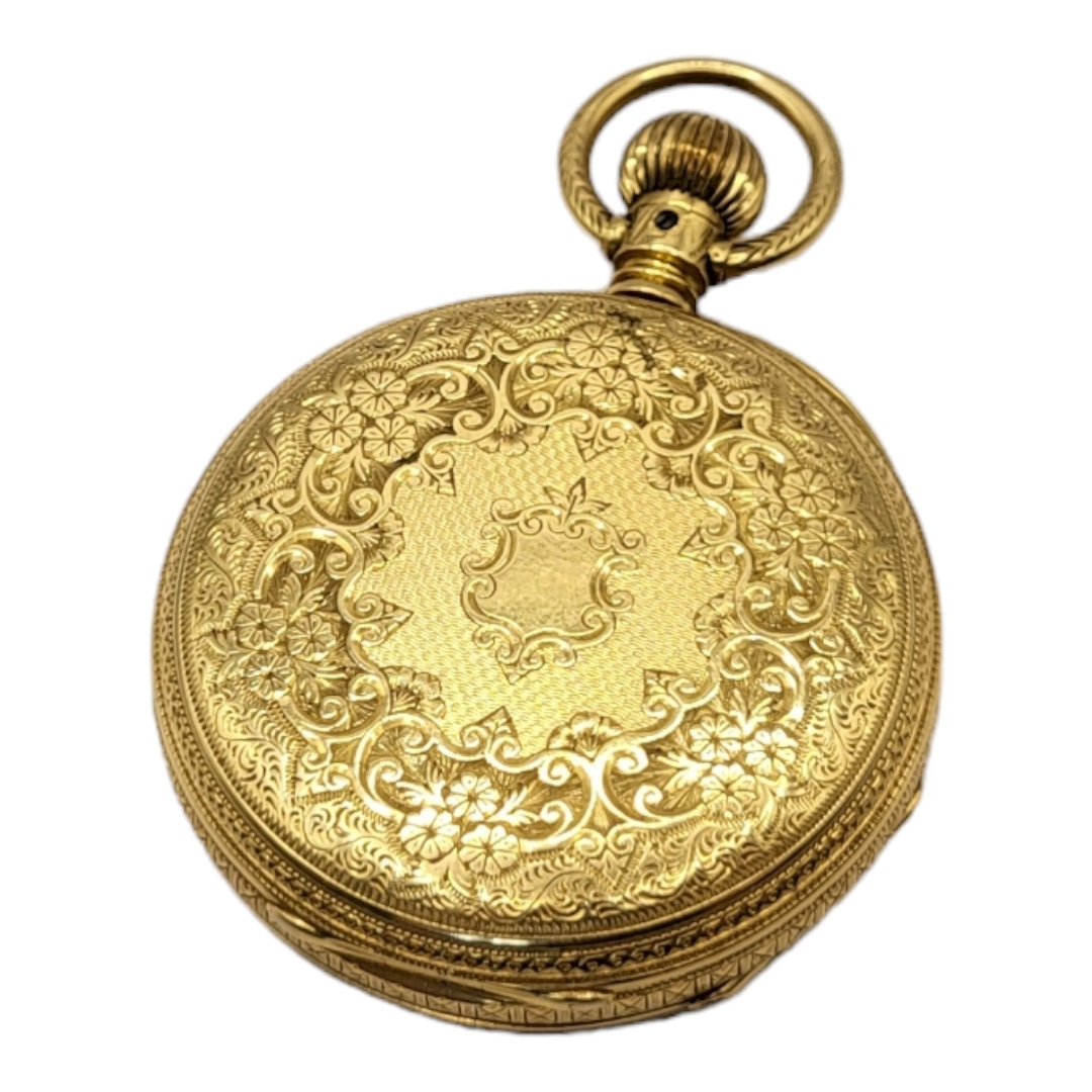 AN EARLY 20TH CENTURY 18CT GOLD POCKET WATCH Open face gold tone dial with engraved decoration to - Image 2 of 3