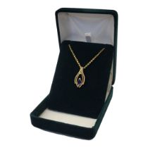 A VINTAGE 18CT GOLD, SAPPHIRE AND DIAMOND PENDANT NECKLACE The pear cut Sri Lanka/Ceylon sapphire