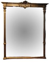 A LARGE VICTORIAN GILT FRAMED MIRROR With fleur-de-lis crest flanked by columns. (w 142cm x 160cm)