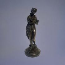 A 19TH CENTURY CONTINENTAL BRONZE FIGURE Classical form maiden with hand mirror, on black slate