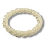 A WHITE JADEITE ROPE TWIST BANGLE. (inside diameter 6cm) Condition: good overall