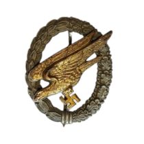 A WWII GERMAN LUFTWAFFE PARATROOPER BADGE Having a gilt eagle with swastika within a wreath. (approx