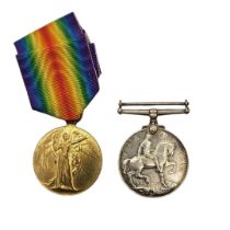 A PAIR OF WWI BRITISH WAR MEDALS To include a silver Defence medal and bronze Victory medal, awarded