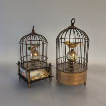 AN ORIENTAL AUTOMATED BIRDCAGE CLOCK Having two feathered birds perched on a rotating central