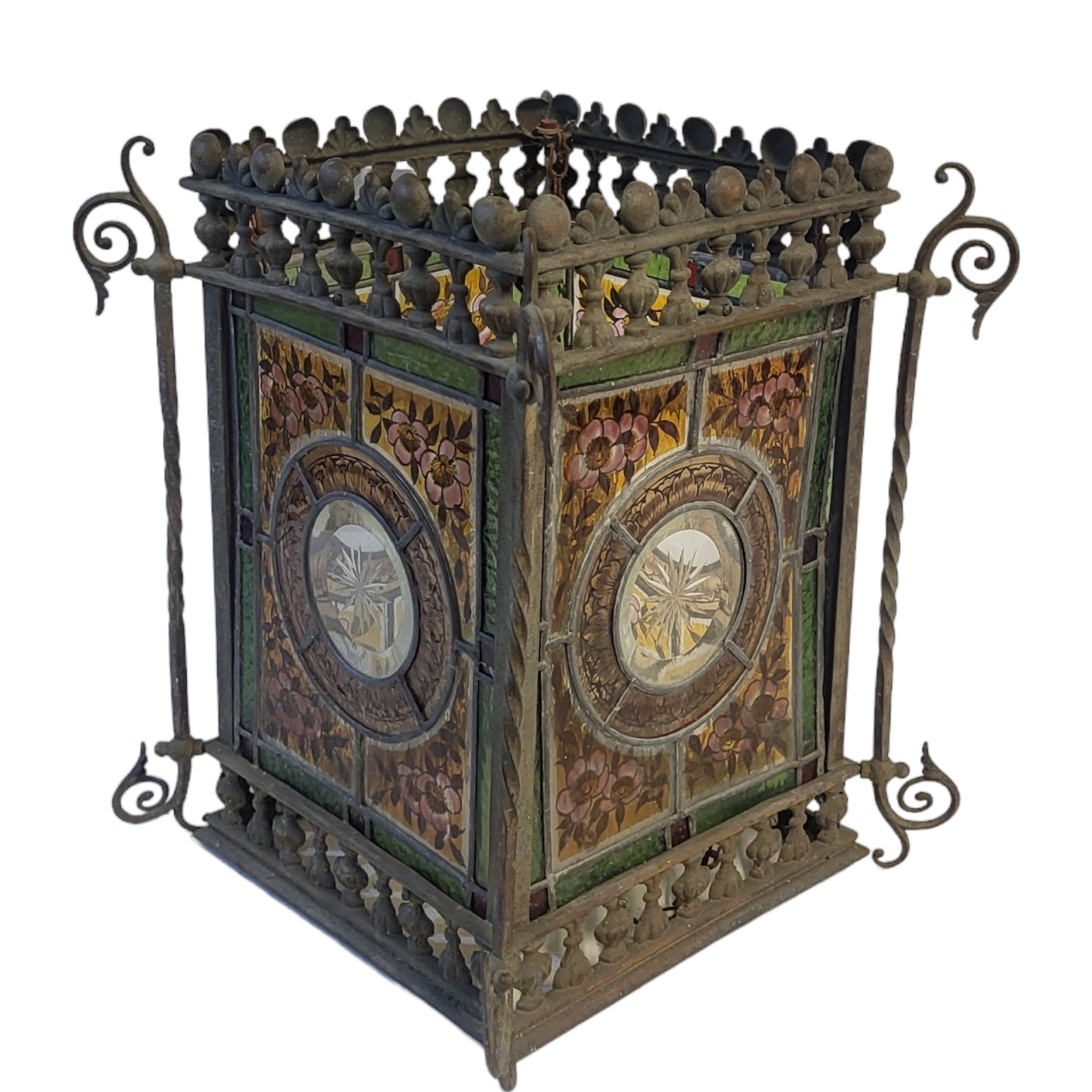 A VICTORIAN AESTHETIC MOVEMENT STAINED GLASS AND METAL LANTERN Four coloured glass panels within a