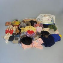 A MIXED SELECTION OF EARLY 20TH CENTURY DOLLS ACCESSORIES Consisting of various part costumes,