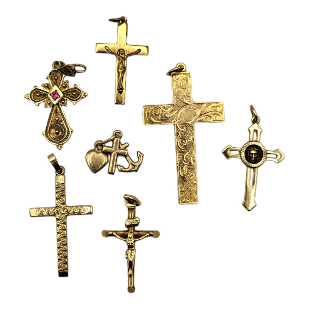 A COLLECTION OF VINTAGE 9CT GOLD CRUCIFIX PENDANTS Various designs. (largest pendant approx 4cm)