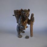 A LATE 19TH CENTURY BAVARIAN BLACK FOREST NOVELTY CARVING, A TRAVELLING THURINGIAN BEAR Carved