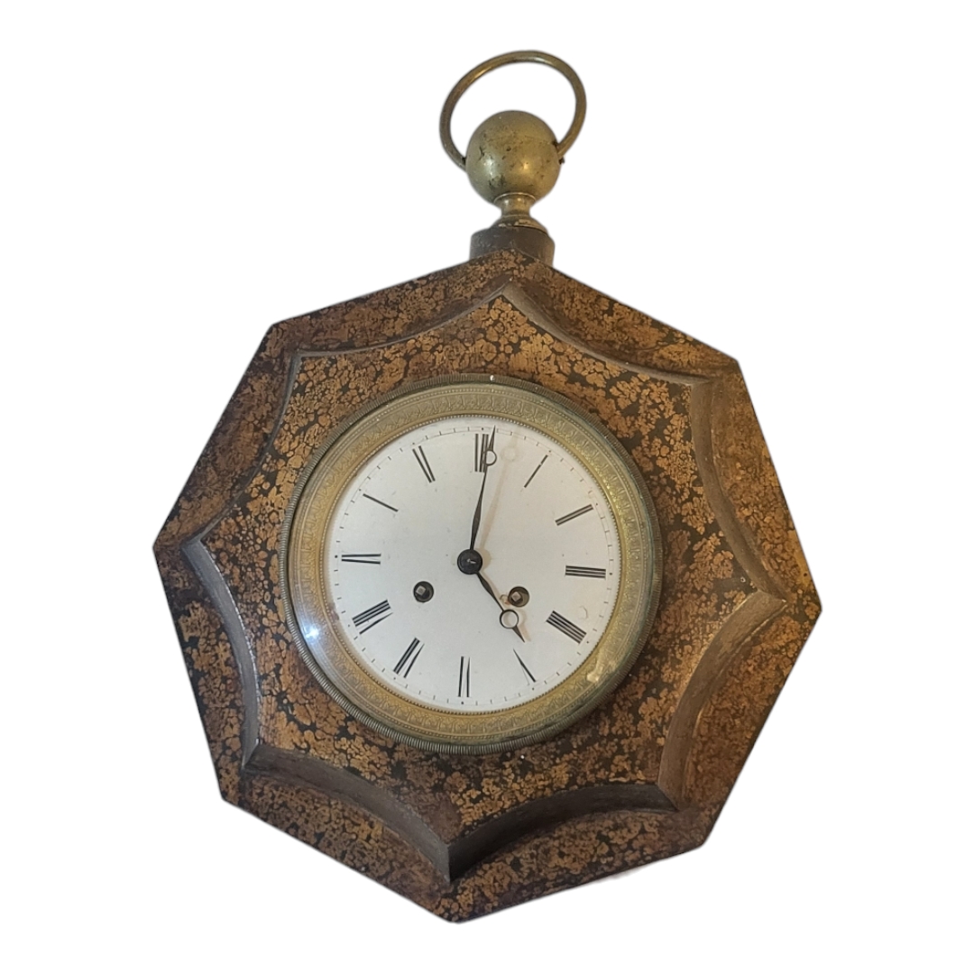 A VICTORIAN TOLEWARE OCTAGONAL DECORATED WALL HANGING CLOCK With white enamelled dial, chiming