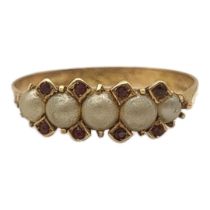 AN EARLY 20TH CENTURY YELLOW METAL, SEED PEARL AND RUBY RING Five pearls interspersed with