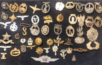 A COLLECTION OF VARIOUS MILITARY BADGES To include German.