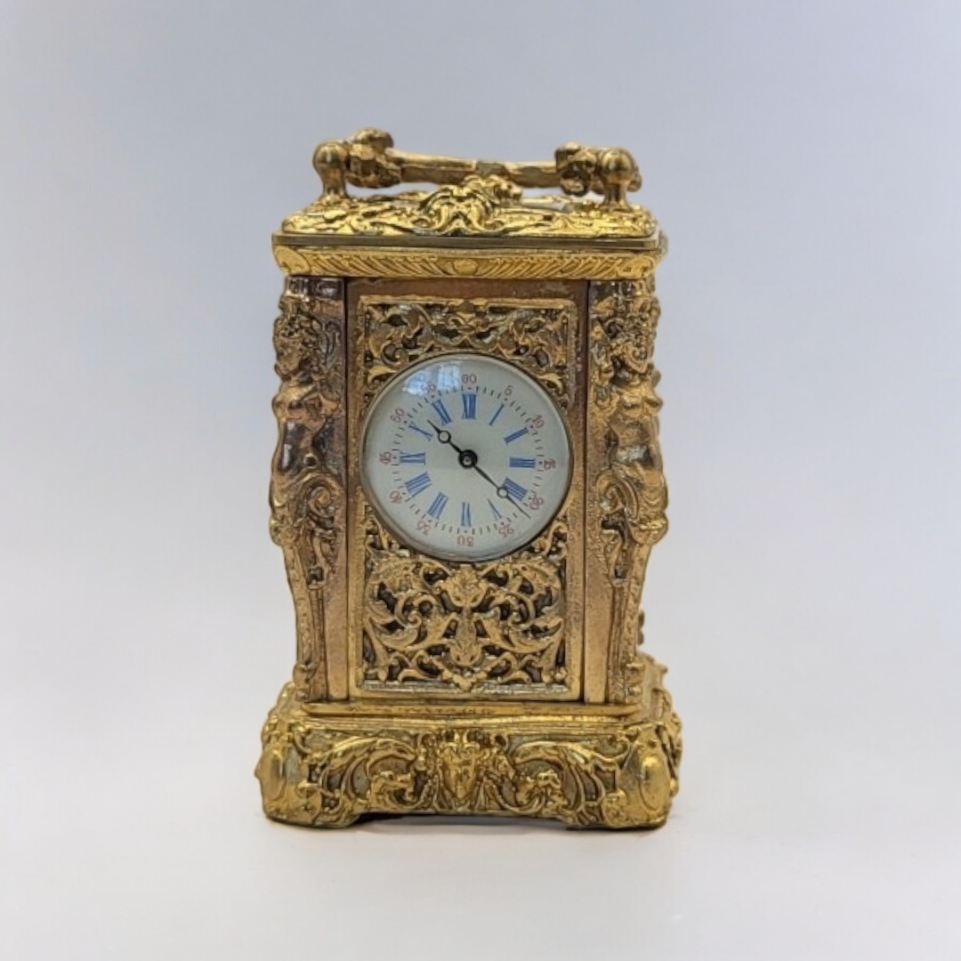A 19TH CENTURY ROCOCO STYLE GILT BRONZE MINI CARRIAGE CLOCK Bevelled glass panel to the top