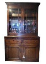 A 19TH CENTURY OAK DRESSER With two glazed doors above two drawers and cupboards. (119cm x 45cm x