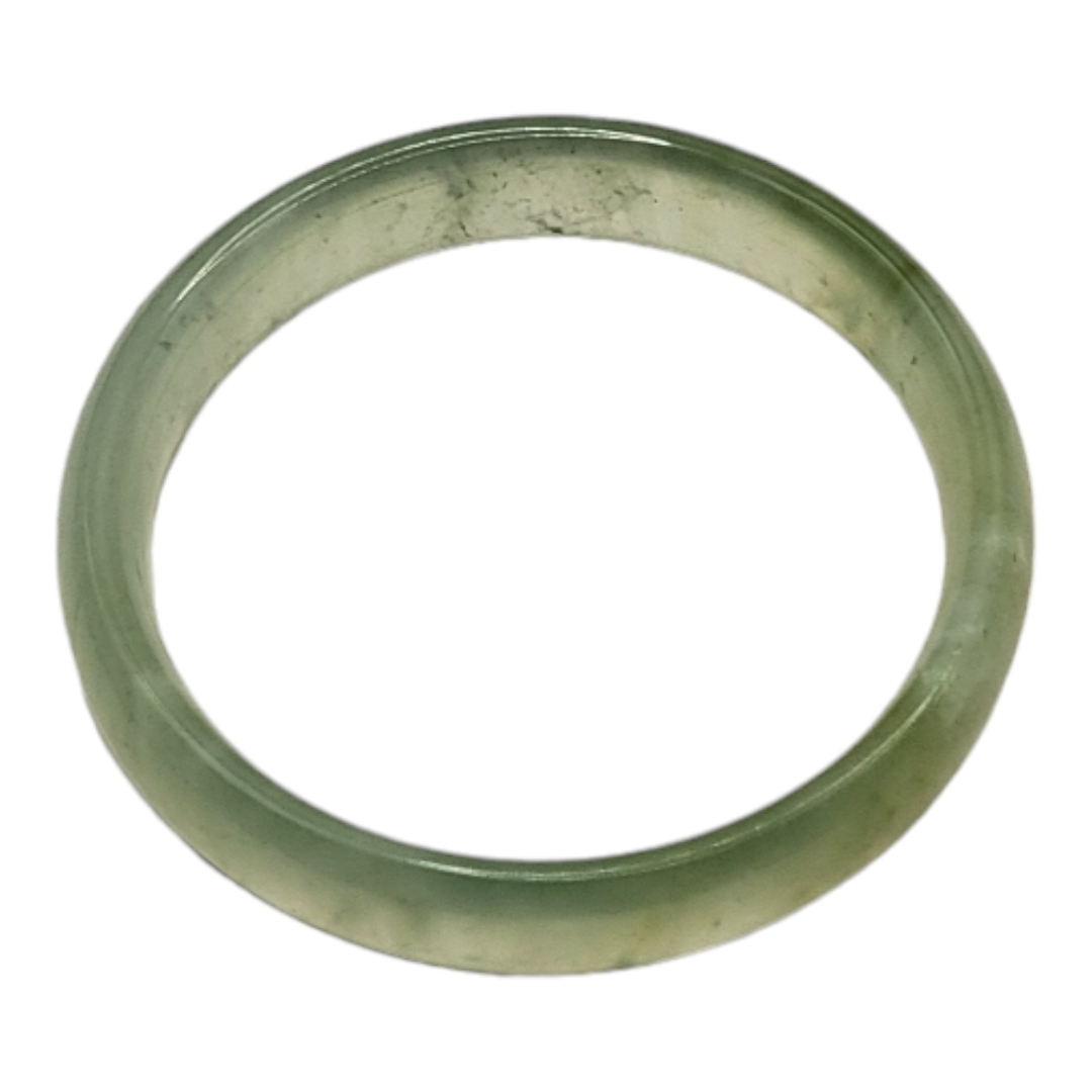 A PALE GREEN CELADON JADE BANGLE (inside diameter 6cm) Condition: good overall