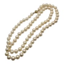 A VINTAGE CONTINENTAL 14CT GOLD AND PEARL NECKLACE Having a single strand with spherical 14ct gold