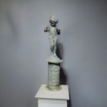 A 19TH CENTURY LEAD STATUE OF A BOY/PUTTI On repoussé plinth. (54cm, 92 including plinth) Condition: