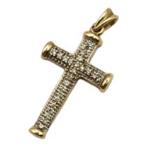 A VINTAGE 9CT GOLD AND DIAMOND CRUCIFIX PENDANT Set with round cut diamonds. (approx diamond