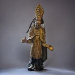 AN 18TH/19TH CENTURY CONTINENTAL ECCLESIASTICAL CARVED STATUE OF A BISHOP With polychrome decoration