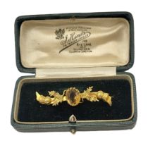 HINDS OF ISLINGTON, A VICTORIAN 9CT GOLD AND CITRINE BROOCH The oval cut stone with Scottish thistle