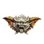 A STERLING SILVER AND AMBER ENAMEL WINGED DEVIL BROOCH With impressed mark verso. (5.5cm x 2.5cm)