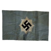 A WWII GERMAN RLB ARMBAND On a pale blue cloth marked ‘GES GESCH H’ and ‘F’. (approx 16.5cm x 10.