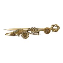 A VICTORIAN YELLOW METAL AND DIAMOND STICK PIN Having a single round cut diamond together with a