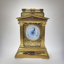 A 19TH CENTURY GILT BRASS REPEATER CARRIAGE CLOCK Architectural form with column supports, blue