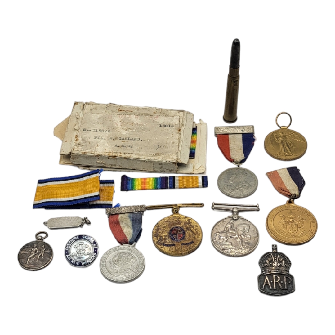 A PAIR OF WWI WAR MEDALS, AWARDED TO S4-215872 PTE F GARLAND Together with an ARP badge, bullet