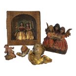 A CONTINENTAL CARVED WOODEN AND DECORATED GROUP Angelic choir, along with similar plaque and two