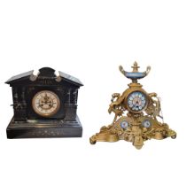 A 19TH CENTURY FRENCH SPELTER AND PORCELAIN MANTLE CLOCK Having an urn form finial and porcelain