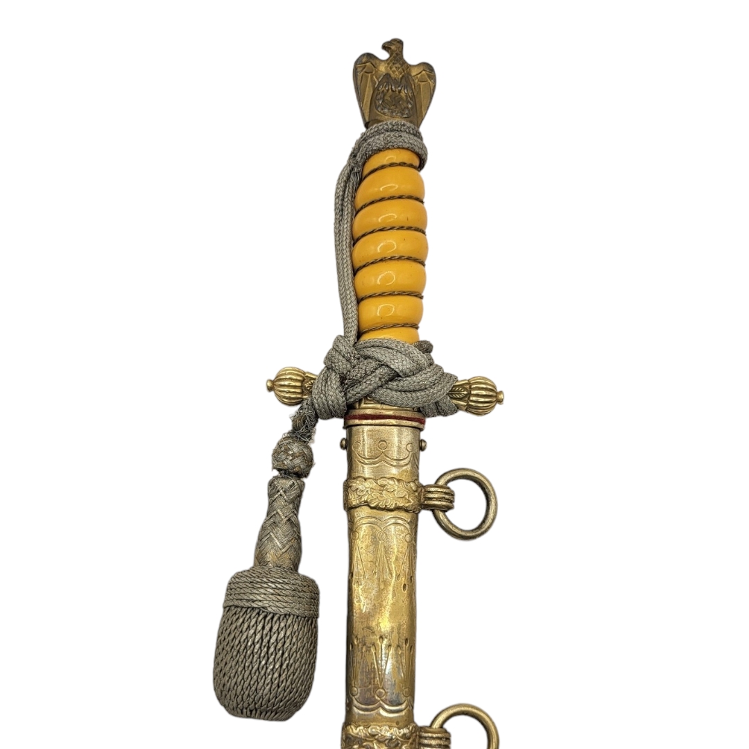 A GERMAN WWII NAVAL OFFICER’S DAGGER AND DECORATED SCABBARD With yellow grip, silver braid knot, - Image 4 of 4