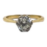 A VINTAGE 18CT GOLD AND QUARTZ SOLITAIRE RING The single round cut stone in a plain design. (size J)