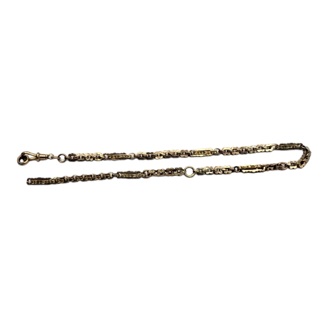 A VICTORIAN 9CT GOLD ALBERTINA WATCH CHAIN Oval form links with engraved decoration. (approx 31cm)