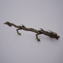 A JAPANESE STYLE BRONZE DRAGON Balanced on all four feet with flaming tail. (15.5cm) Condition: good