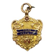 AN EARLY 20TH CENTURY 9CT GOLD AND ENAMEL WATCH FOB Marked 'Colne and Burnley WMC and IU’,