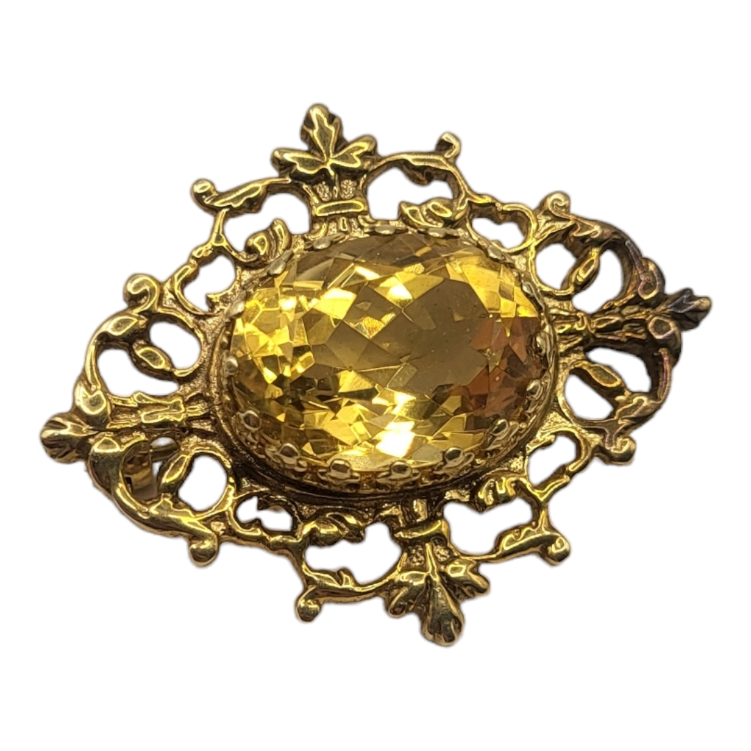 A VINTAGE 9CT GOLD AND CITRINE BROOCH The central oval faceted stone in a pierced design, in a - Image 2 of 3