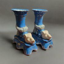 A PAIR OF SEVRÈS STYLE LIGHT BLUE CERAMIC CORNUCOPIA VASES The body ornamentally dressed with