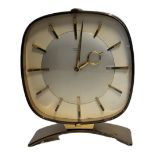 JUNGHANS, A MID CENTURY GILT BRASS MANTLE CLOCK Oval case with mechanical movement and arched