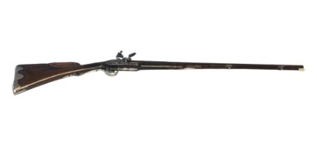 AN EARLY 19TH CENTURY FLINTLOCK SPORTING RIFLE The finely carved walnut stock with silver inlays and