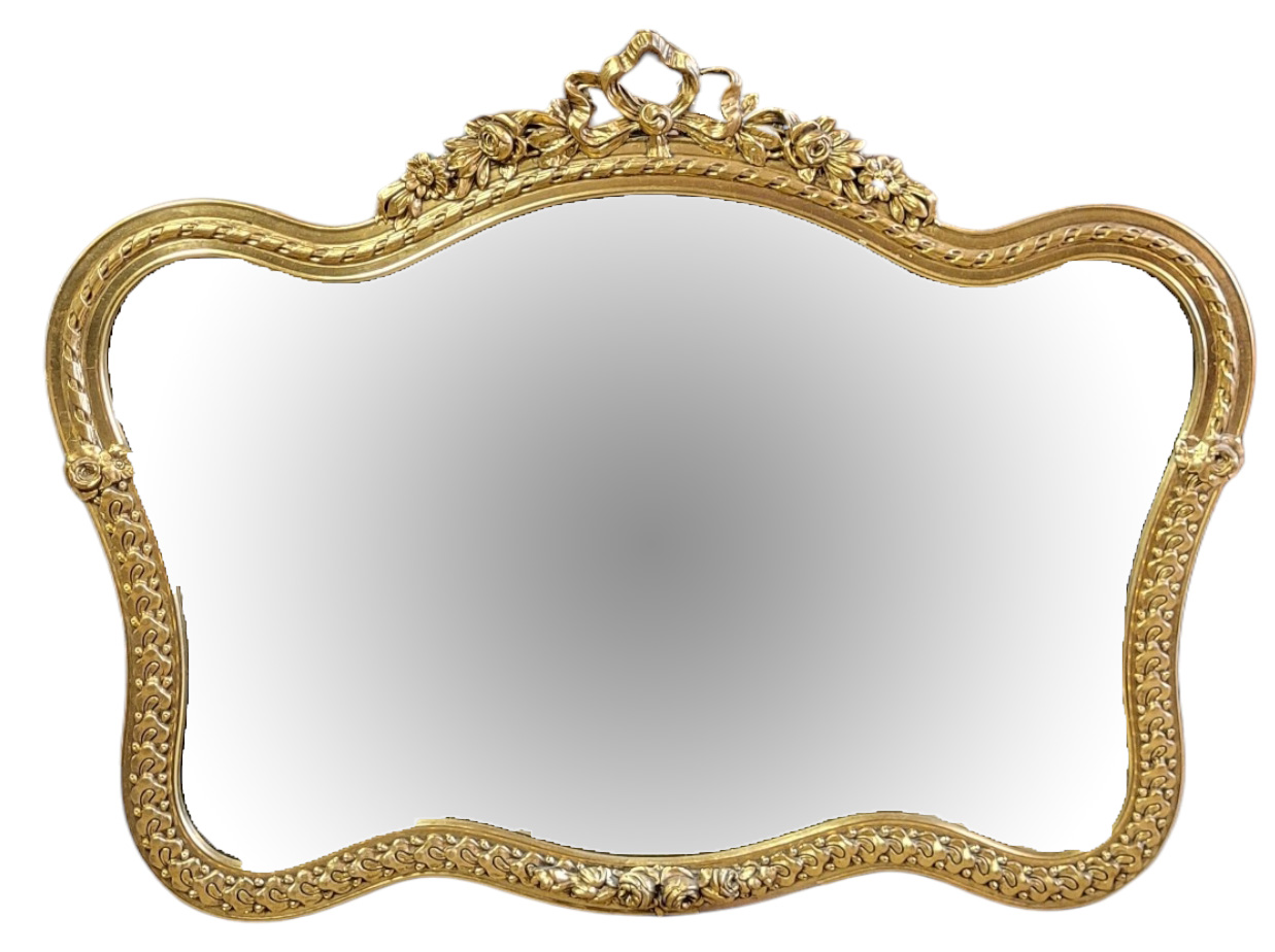 A LATE 20TH CENTURY CARTOUCHE SHAPED ORNAMENTAL GILDED OVERMANTEL MIRROR Moulded with flowering