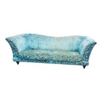 AN ART DECO INSPIRED SCROLL BACK THREE SEAT SETTEE Generous proportions, in turquoise cut velvet